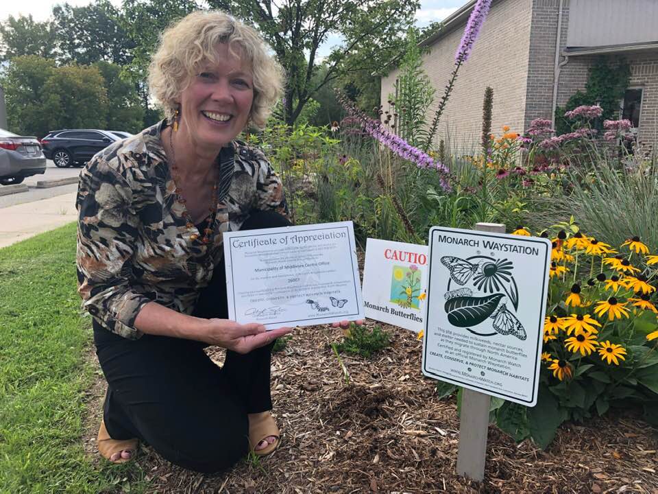 Mayor Aina DeViet next to Middlesex Centre Main Office Pollinator Garden